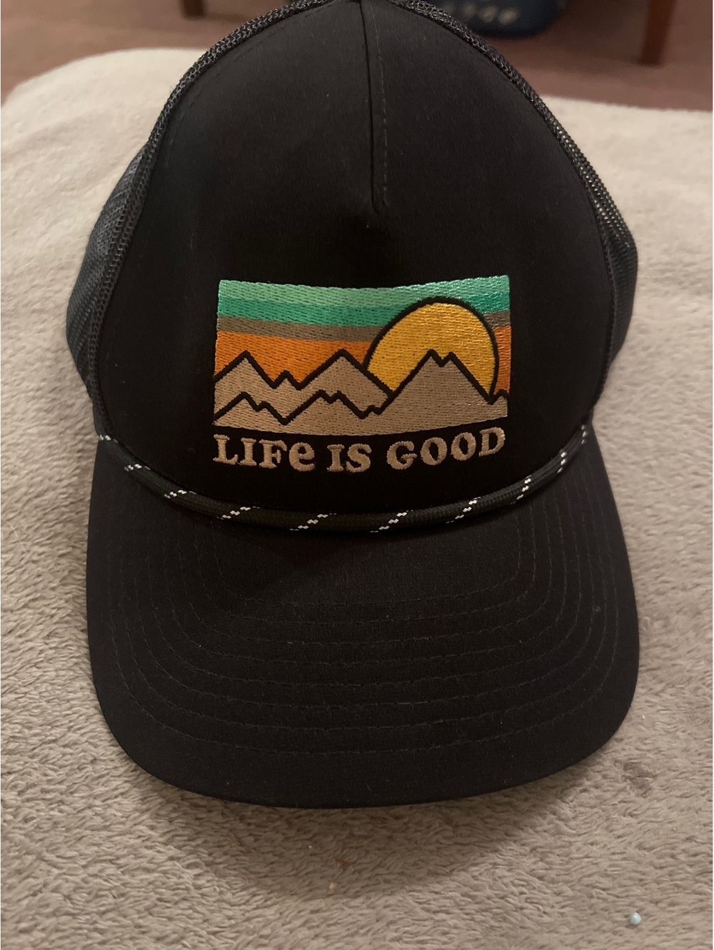 Life is Good Black Mesh Trucker Hat with Mountain Sunset Patch